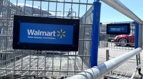 Shopping carts in the parking lot of a Walmart store